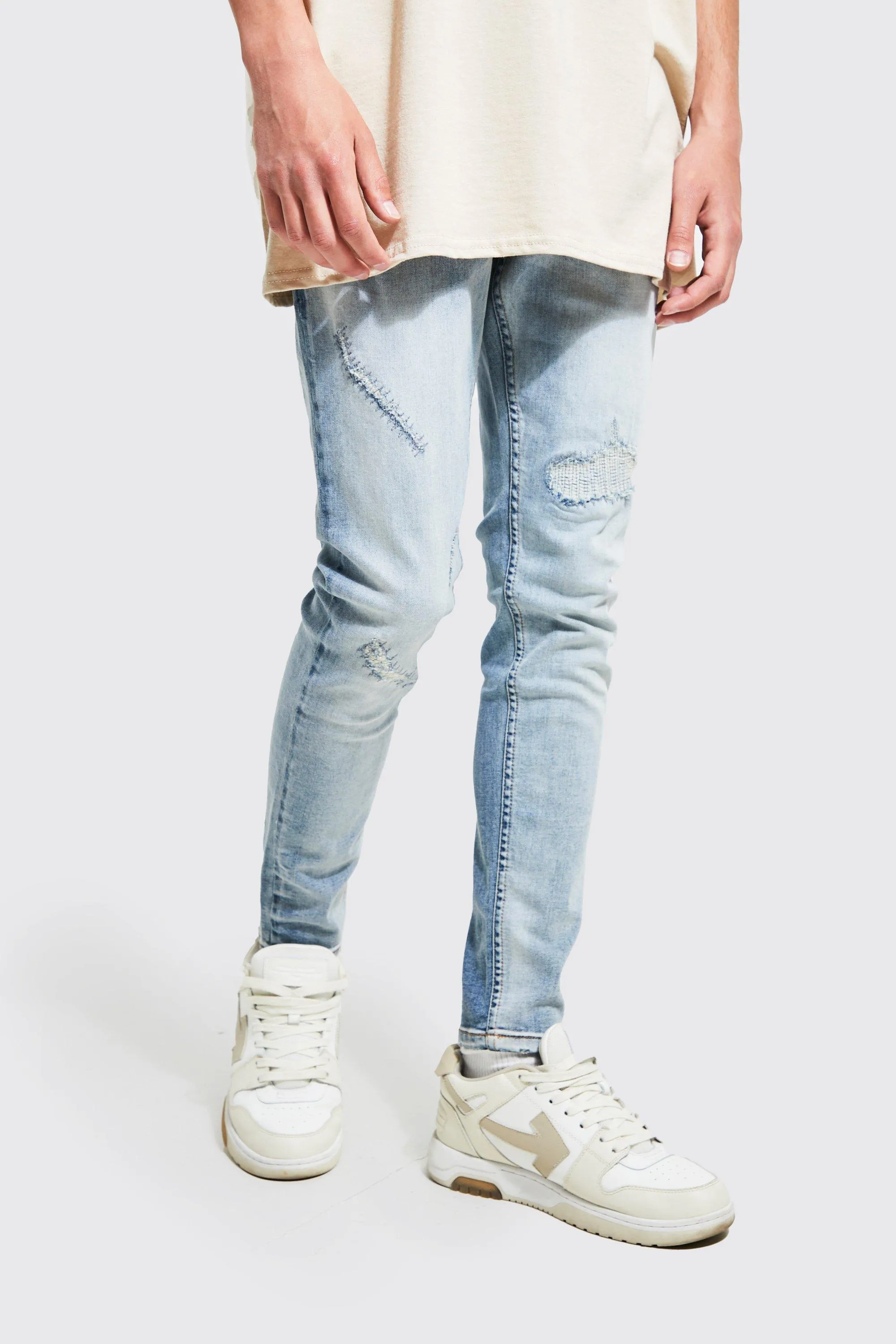 Skinny Stretch Rip And Repair Stitched Jeans